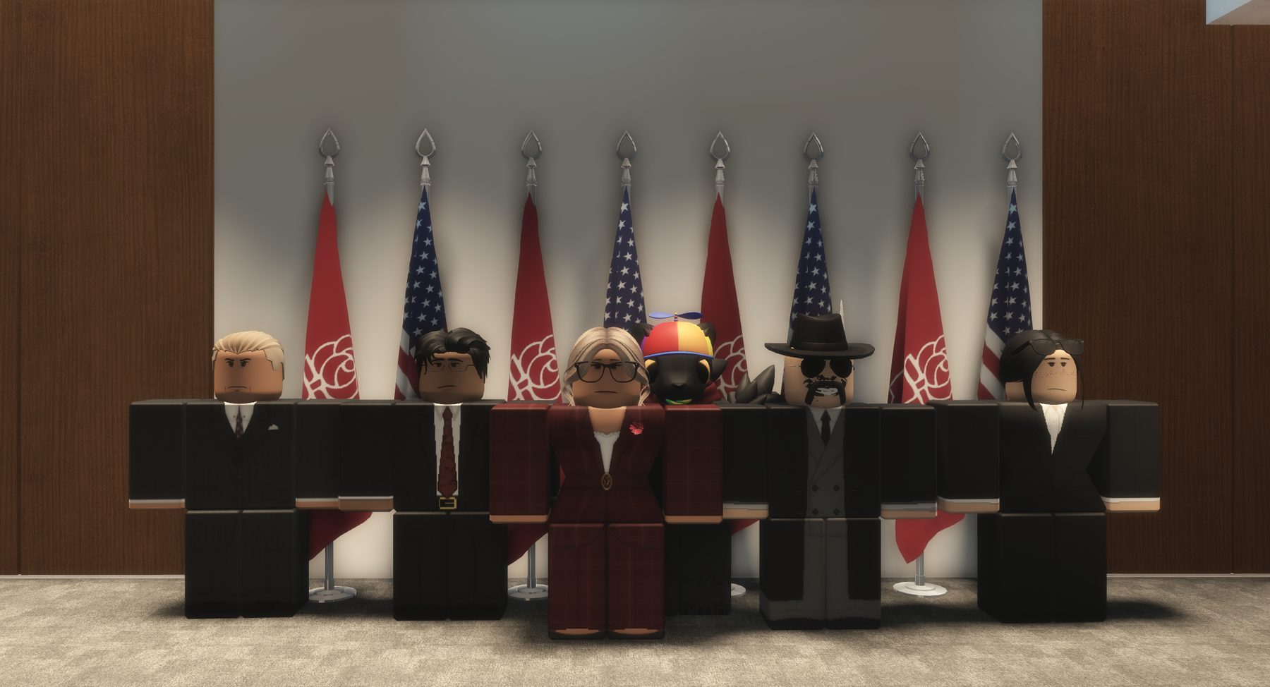A cabinet line-up in front of the flags.